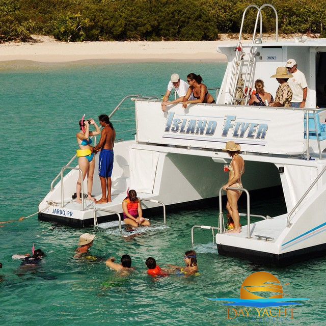 Guests swimming off the yacht swim platform, Puerto Rico boat rental
